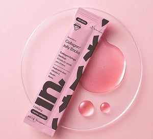 A RIN collagen jelly stick packet on a clear glass plate.